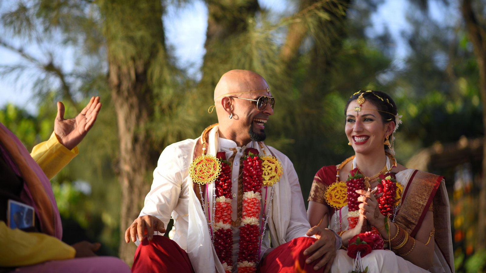 Couple exchanging floral garlands